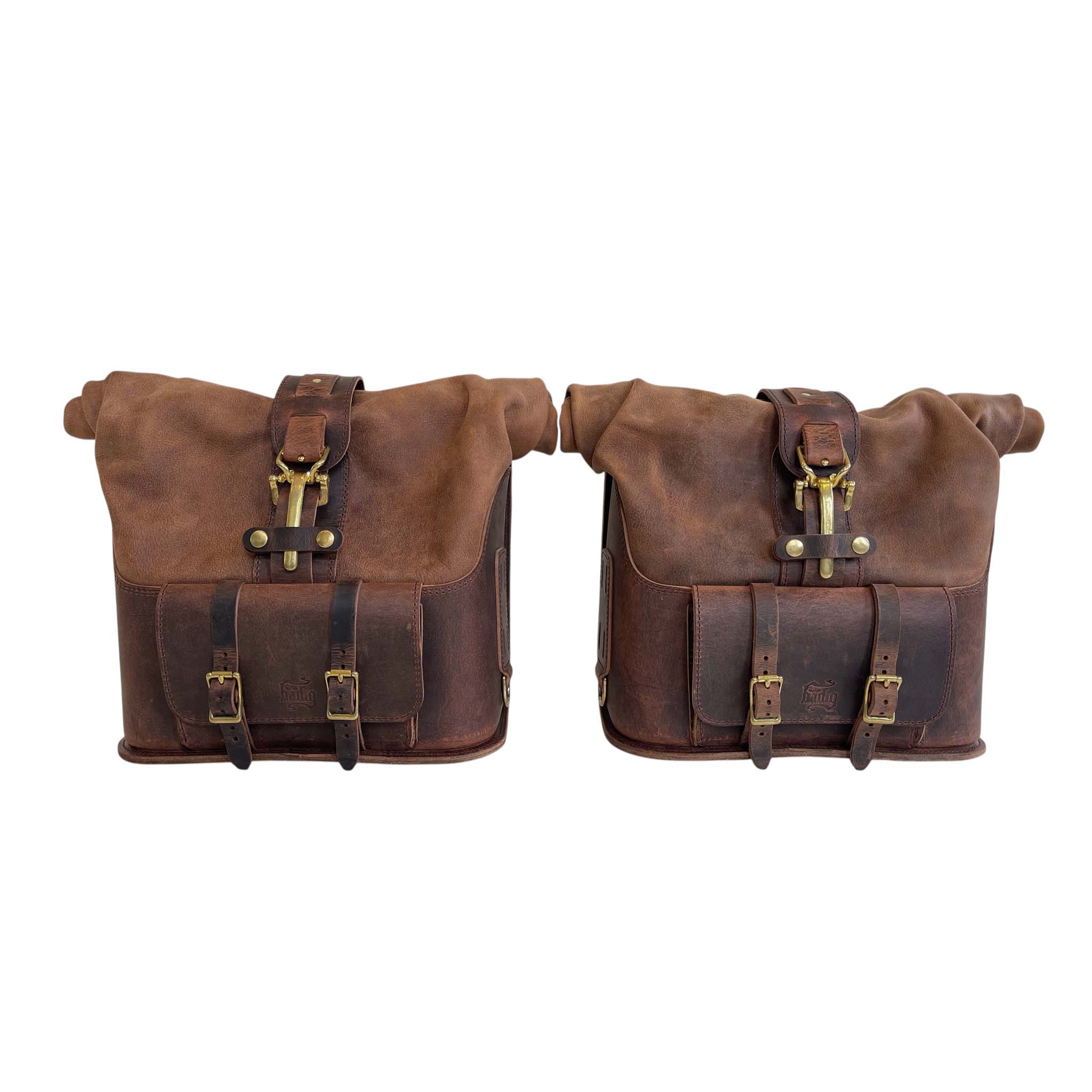 Triumph Bonneville Bobber Panniers Rolltop Swingarm Saddlebags. Hand crafted in USA with premium veg tan water buffalo leather, waterproof liners and solid brass hardware. BAD&G Customs TBP01